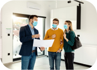 Clients discussing real estate deal with agent while wearing face masks