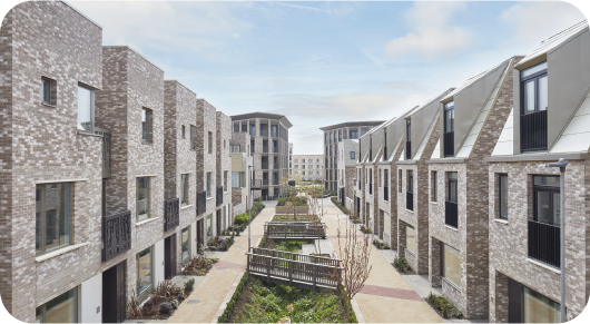 Contemporary row of residential apartment buildings with a central pathway